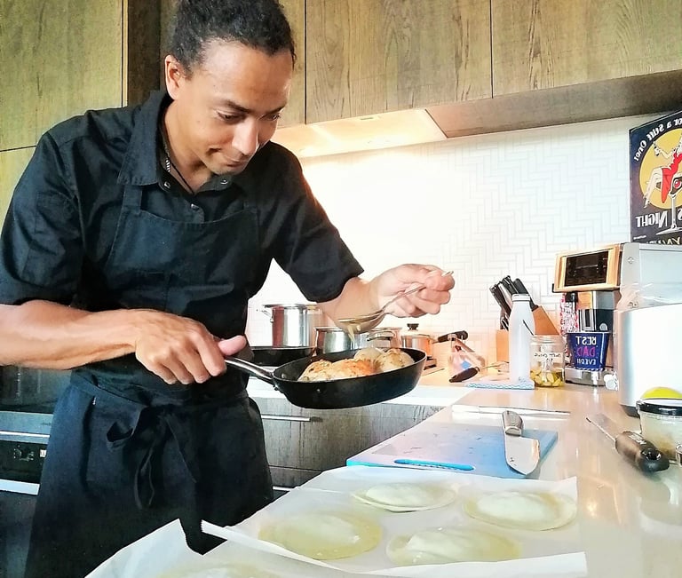 a chef is cooking with a pan