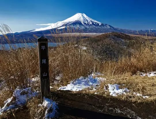 Scenic view of snow-capped Mount Fuji from a hiking trail viewpoint