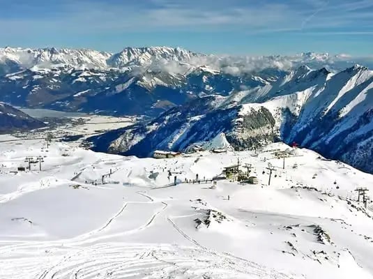 Sunny ski slopes and alpine panorama at Kitzsteinhorn Kaprun Austria skiing.