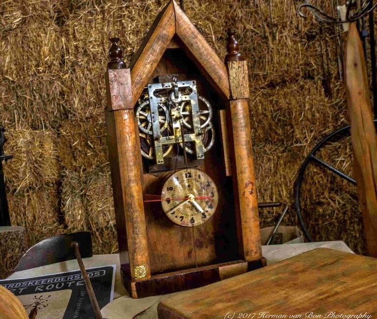Reclaimed material clock with exposed gears in wood by Jan Vingerhoets