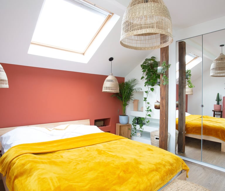 a bedroom with a bed and a mirror