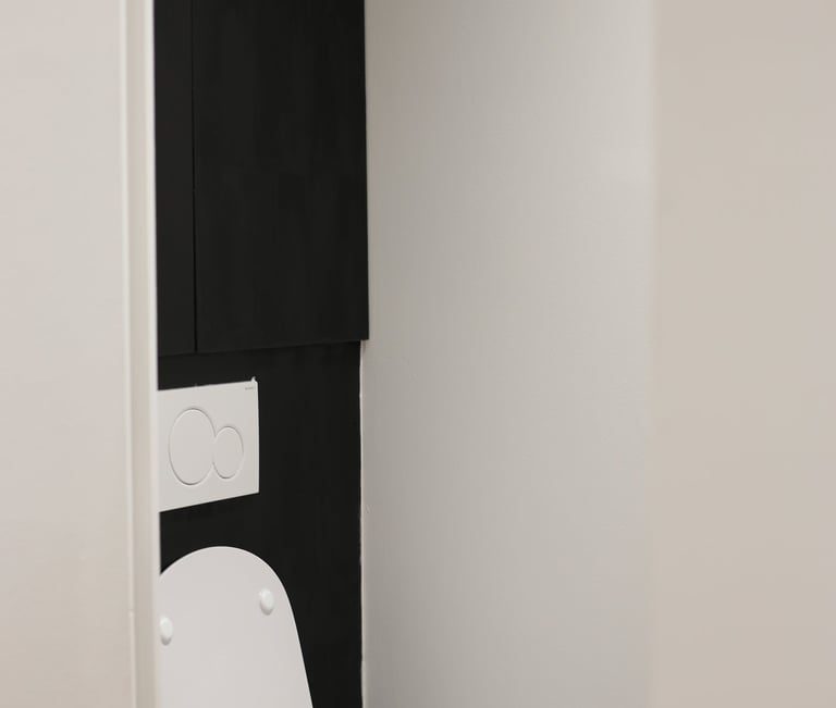 a toilet with a toilet paper roll in the middle of the toilet