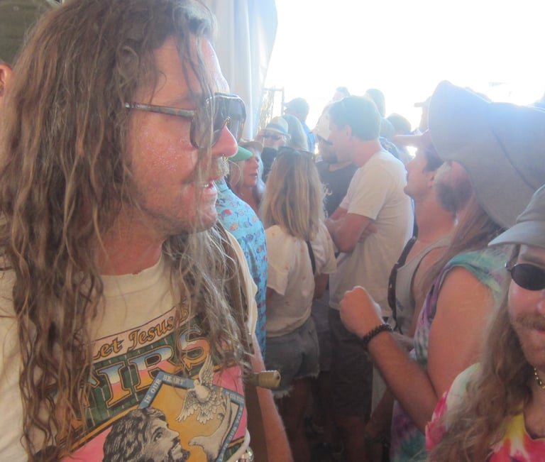 standing in the crowd at a music festival