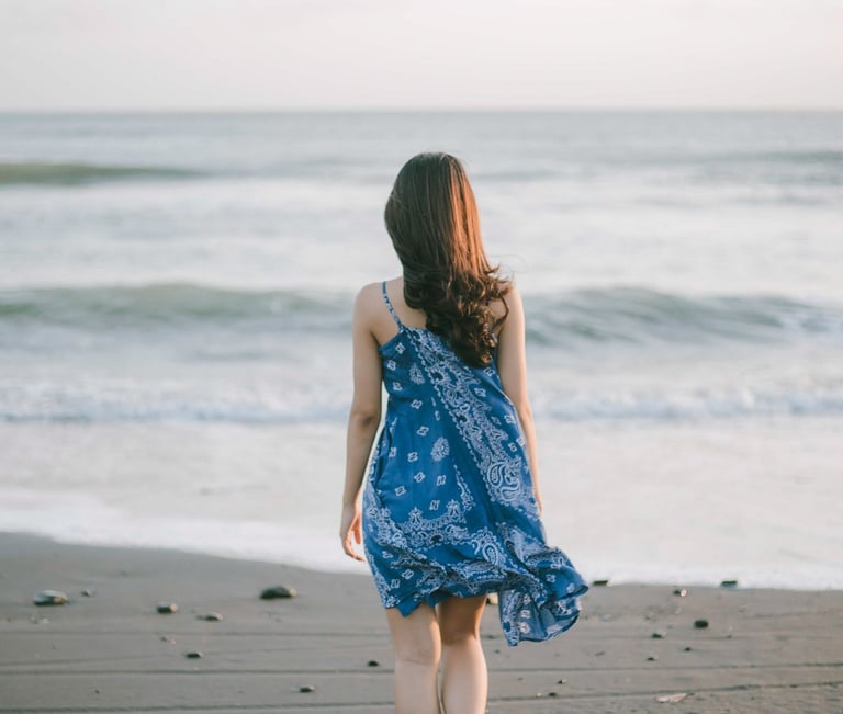 Lifestyle portrait walking along the shoreline at Pantai Nyanyi Tabanan Bali