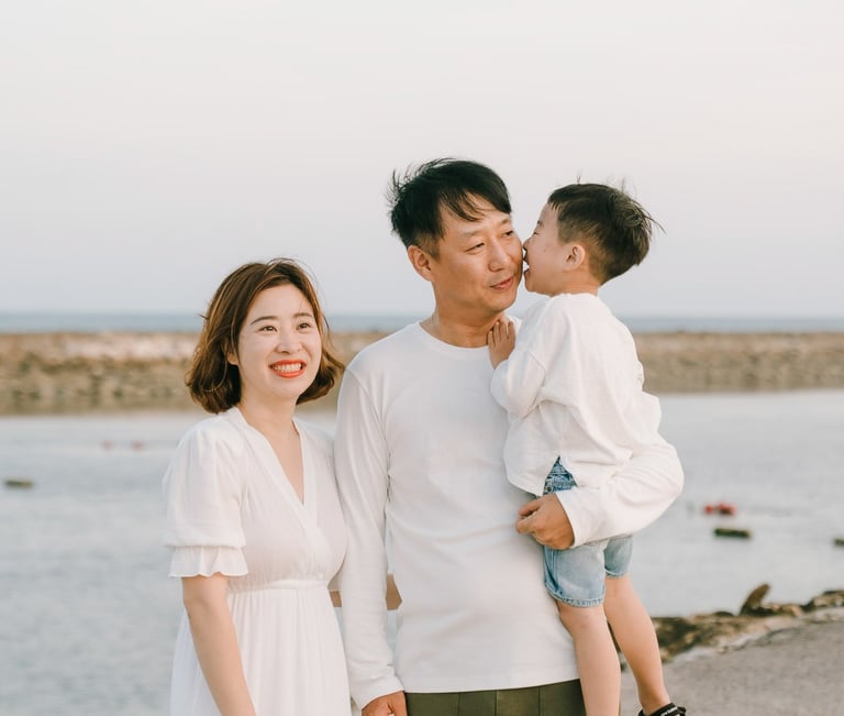 Bali family photography portrait captured at The Apurva Kempinski Bali beachfront.