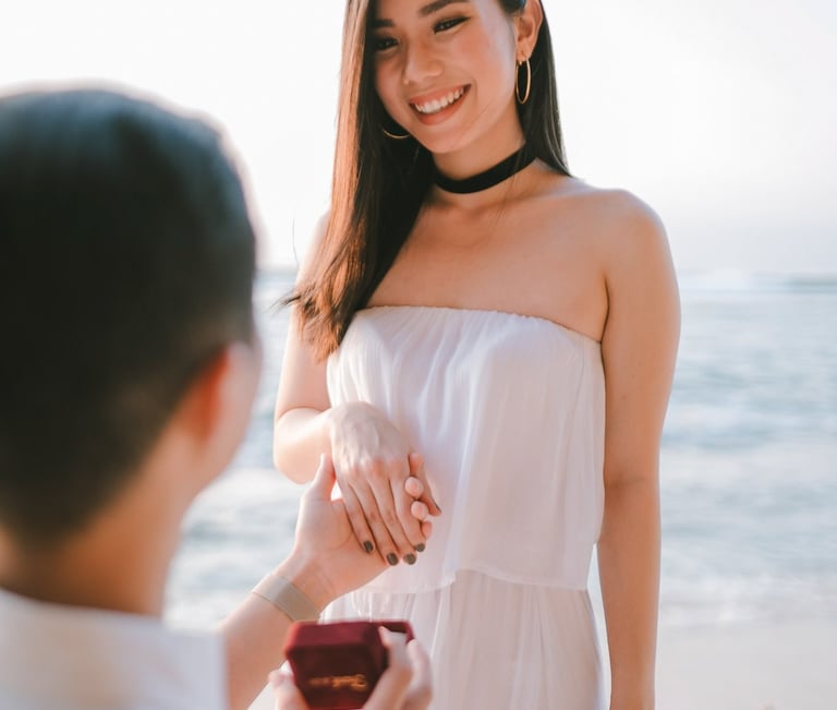 Man proposing on one knee during a couple photography session at Anantara Uluwatu Bali Resort.