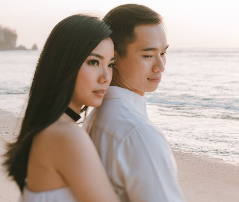 Romantic couple portrait by the beach during a proposal photography session at Anantara Uluwatu Bali Resort.