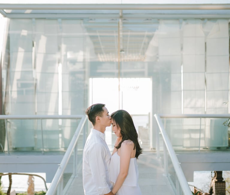 Couple during a proposal photography session in front of the chapel at Anantara Uluwatu Bali Resort.