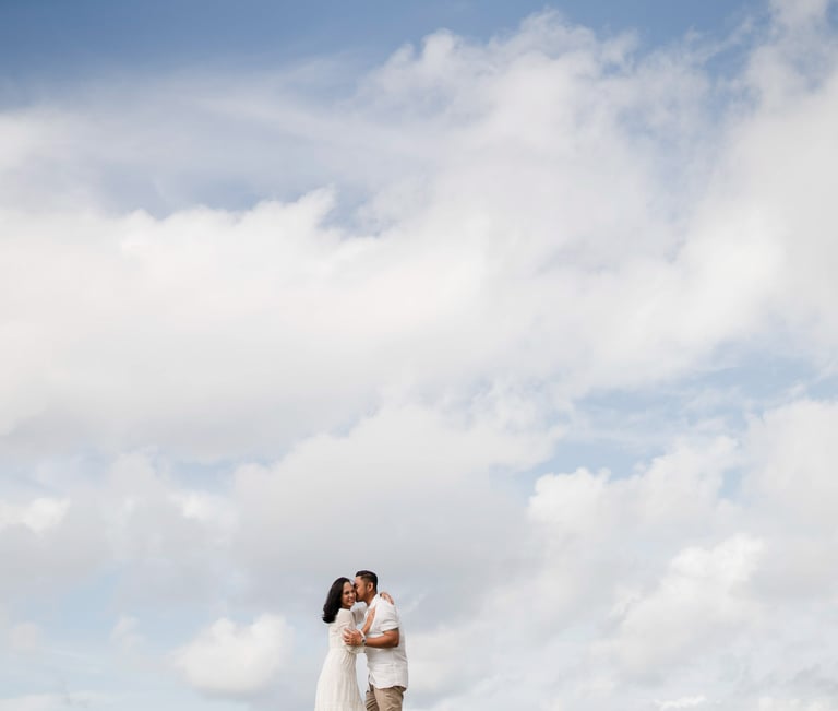 Ayunda family silhouette moment captured against the sky at Melasti Beach Bali.
