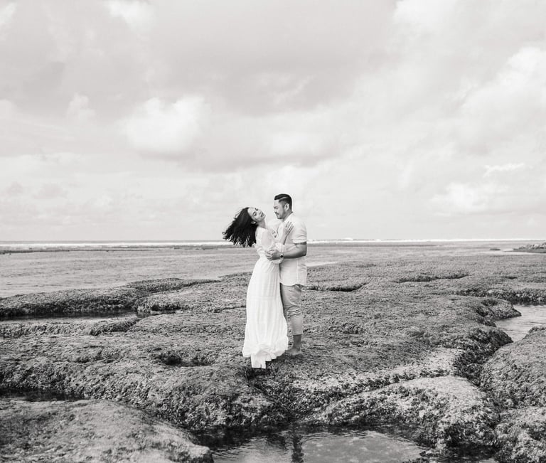 Portrait of Ayunda mother standing gracefully by the cliffs at Melasti Beach Bali.