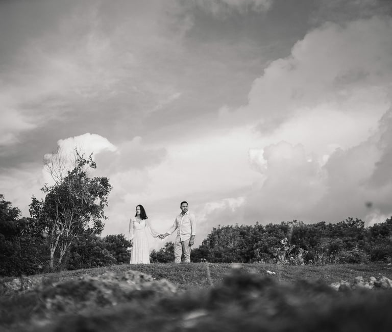 Intimate moment of Ayunda family embracing at Melasti Beach Bali.