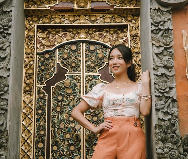 women standing in front of balinesese traditional gate