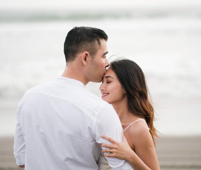 Romantic couple embracing on the beach near Waka Gangga in West Bali