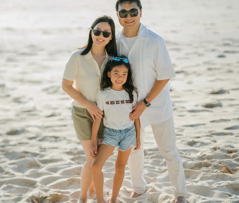 Family portrait captured on the beach at InterContinental Bali Resort during golden hour
