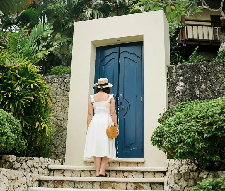 Selly standing near the tropical villa entrance at Karma Kandara Uluwatu Bali  