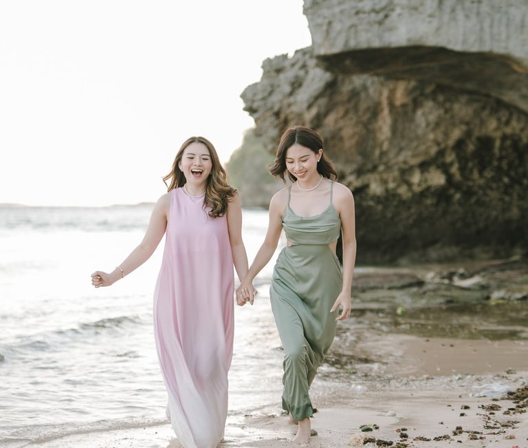 Two friends walking together along the beach during photoshoot at Geger Beach Nusa Dua Bali