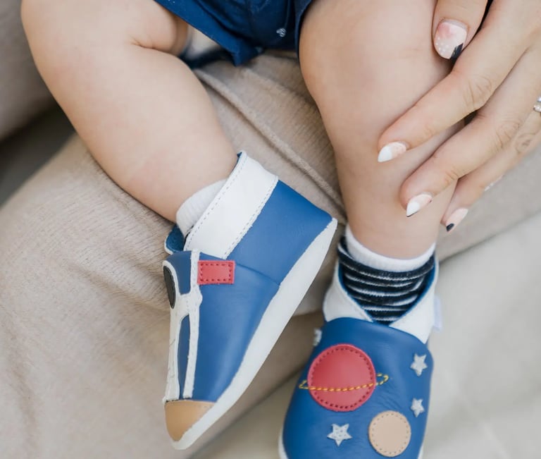 Close-up detail of a baby's feet during a family photography session at Samabe Bali Suites & Villas in Nusa Dua.