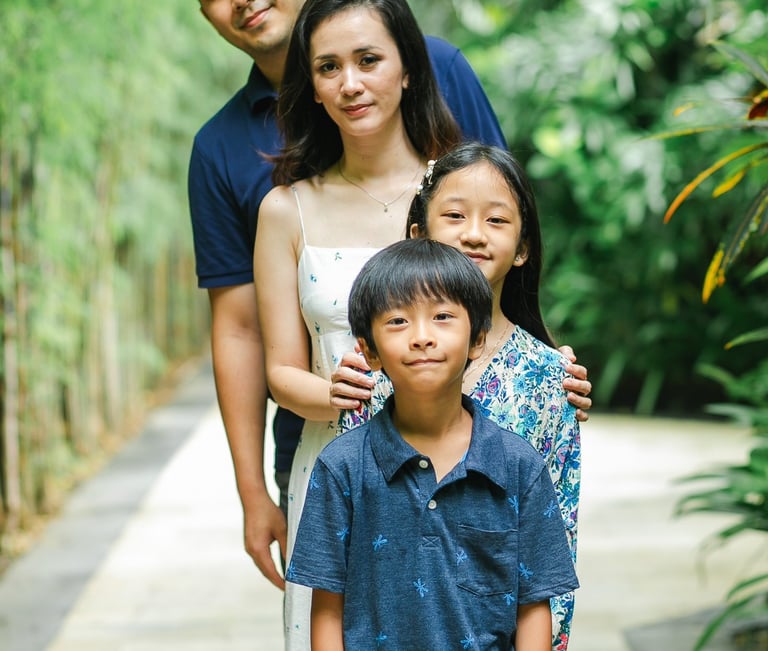 family portrait in tropical setting at Westin Nusa Dua Bali during natural photography session