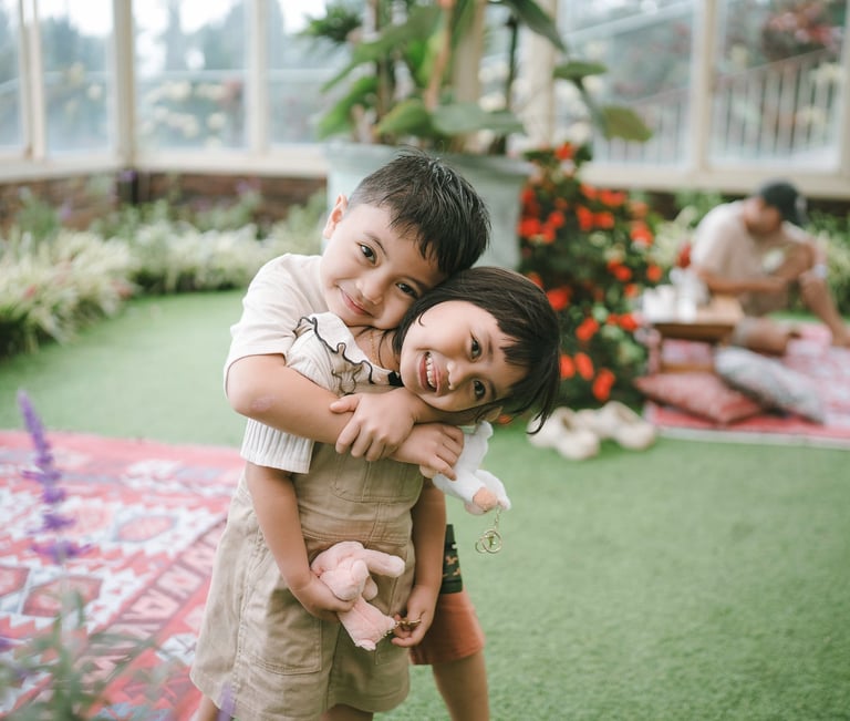 Family portrait inside glass house during a family photography session at Rumah Gemuk Bedugul Bali.
