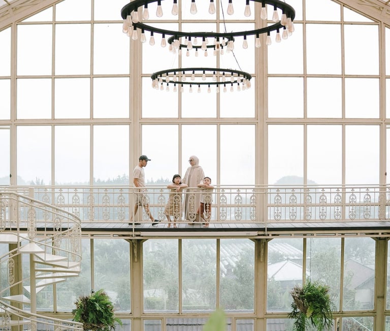 Family walking in rain during a family photography session at Rumah Gemuk Bedugul Bali.