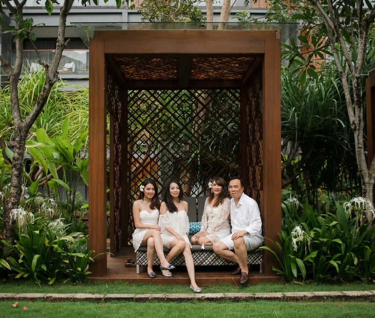 Janice family portrait at Indigo Seminyak Bali surrounded by tropical garden scenery