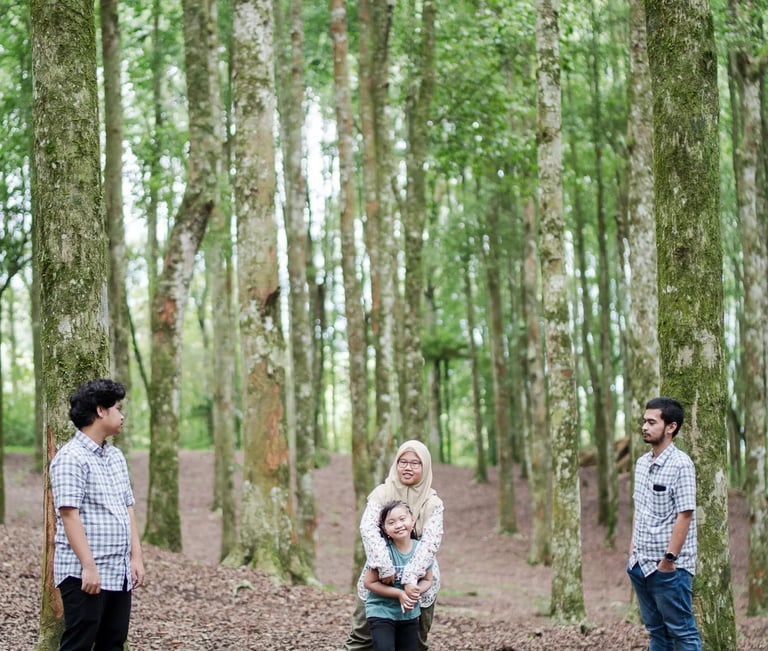 Iqbal family walking through Botanical Garden during a family photography session in Bedugul Bali.