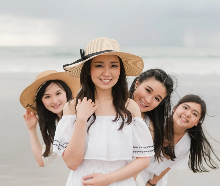 Multigeneration family portrait at Seminyak Beach Bali with joyful natural interaction during sunset family session.