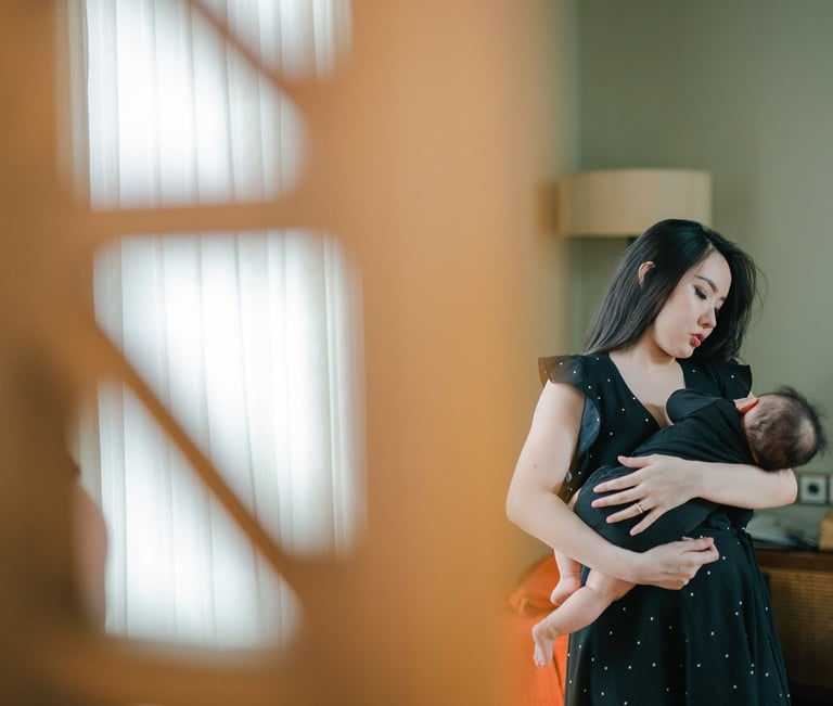 Mother holding baby during a family photography session at a private villa in Ubud Bali.