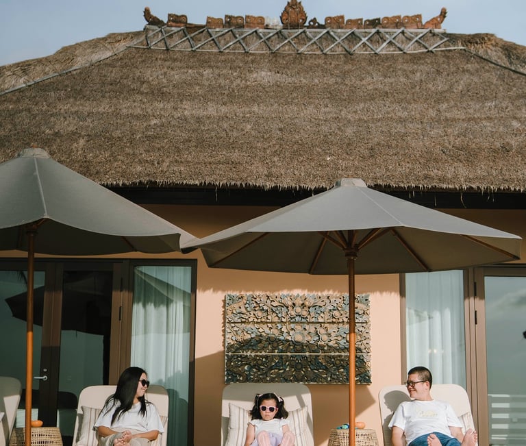 Candid family moment by the private pool at AYANA Villas Jimbaran Bali