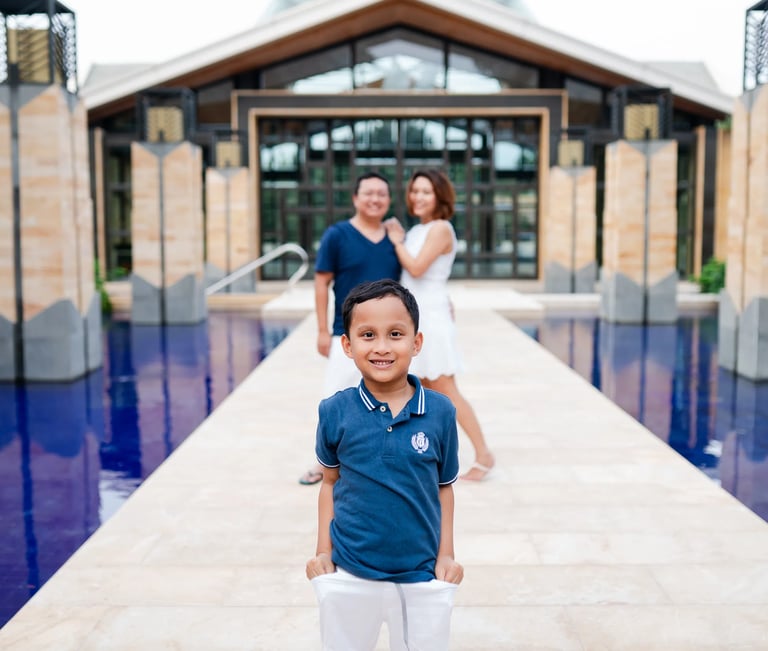 Family portrait on resort walkway at The Mulia Nusa Dua Bali