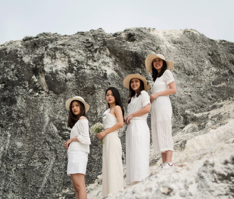 Bridal party group portrait near coastal cliffs at Melasti Beach Bali