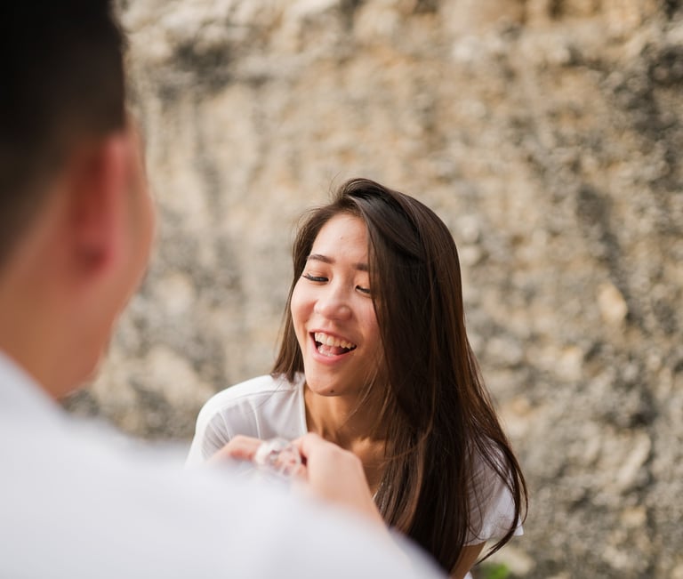 Emotional reaction after proposal during photoshoot at Melasti Beach Bali