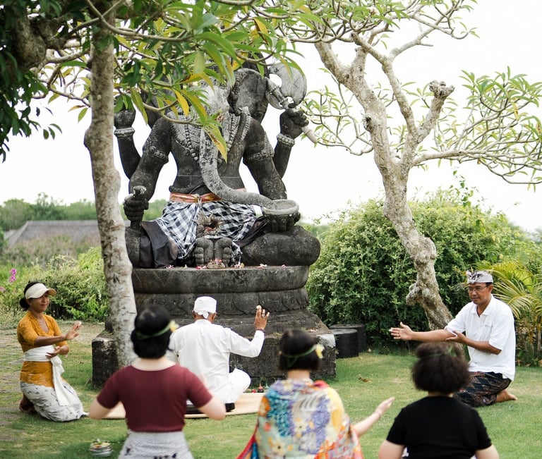 Zhang family participating in a traditional Balinese blessing ceremony at Bvlgari Resort Uluwatu Bali