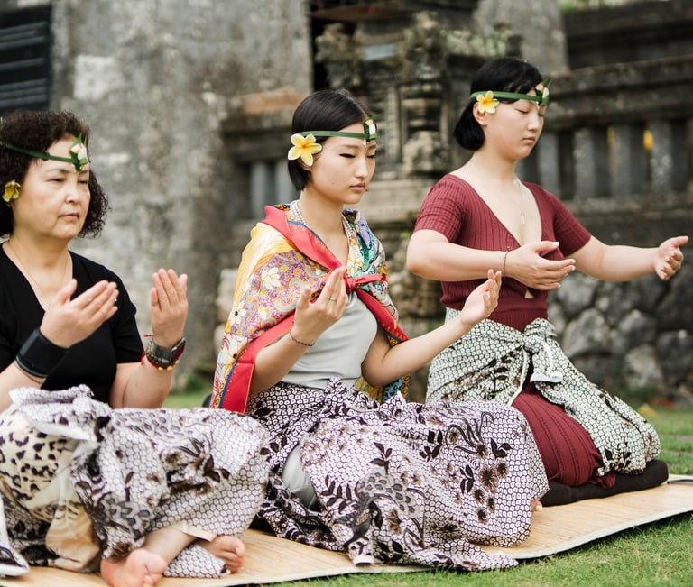 Cultural family ritual in Uluwatu Bali at Bvlgari Resort temple garden, meaningful destination family photography