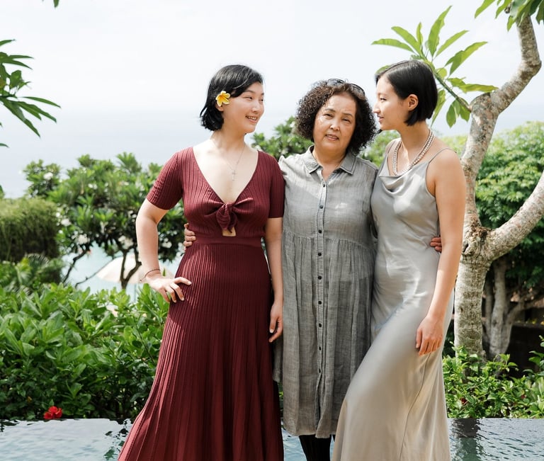 Three-generation family portrait with ocean view at Bvlgari Resort Uluwatu Bali, destination family photography in Bali