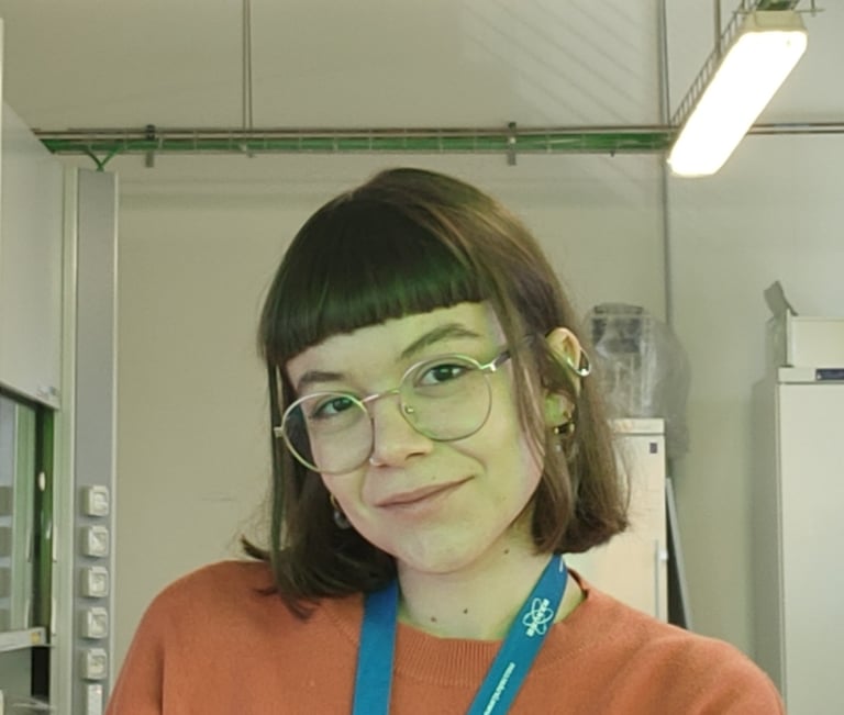 a woman in a red sweater and glasses