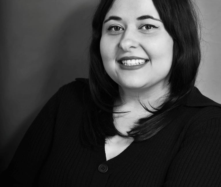 Black and white professional headshot of Emma Santos 