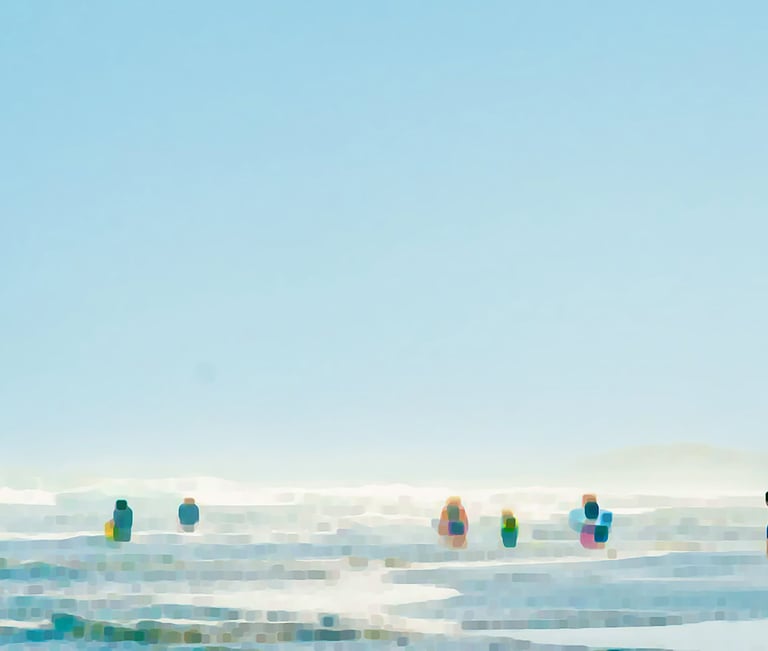 a group of people standing on a beach