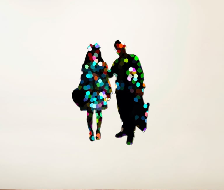 a couple of people standing in front of a white wall