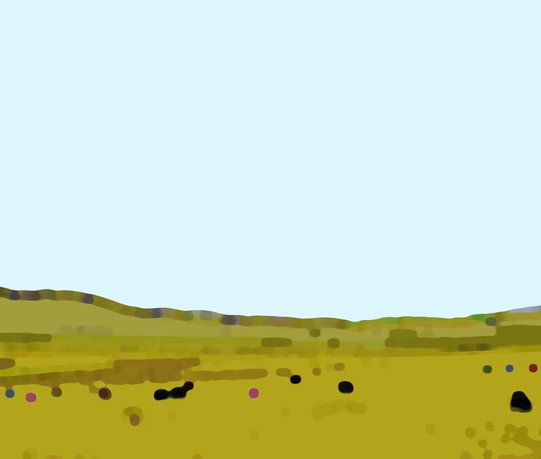 a field with a few cows grazing in the grass