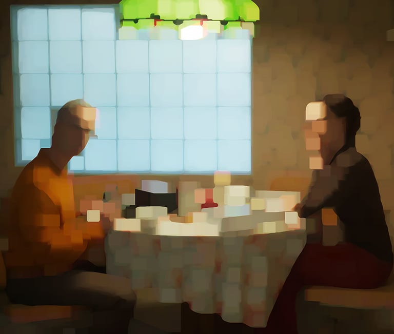 two people sitting at a table with a table cloth