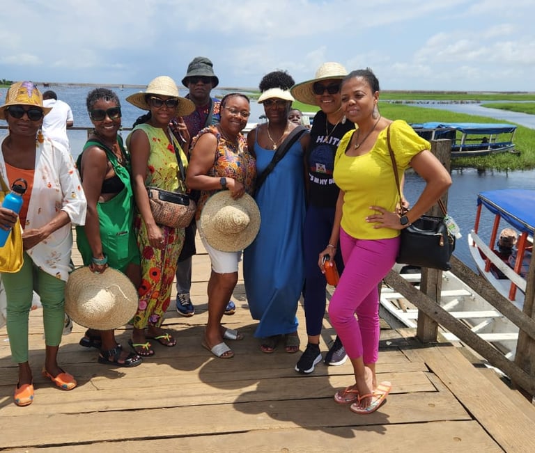 Haitian Diasporas visiting Ganvie Stilt Village in Benin during A multi-country tours