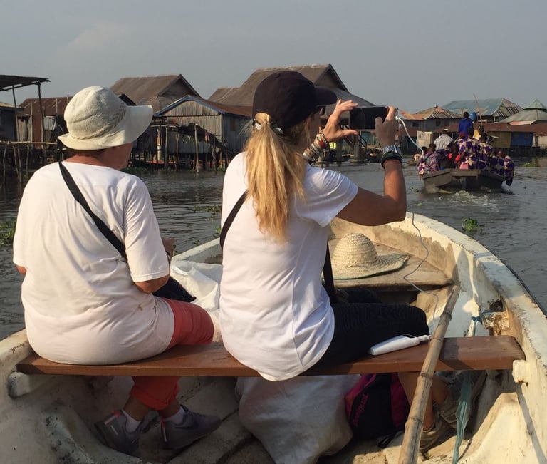 Tourists Visiting Ganvie stilt village during a Multi-country Trips of Senegal, Ivory Coast & Benin