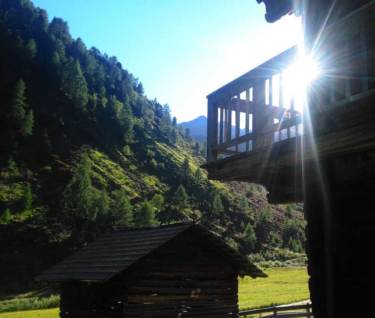 a cabin with a view of a mountain range
