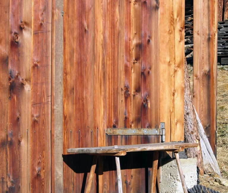a bench with a bench and a bench with a bench in front of a wooden