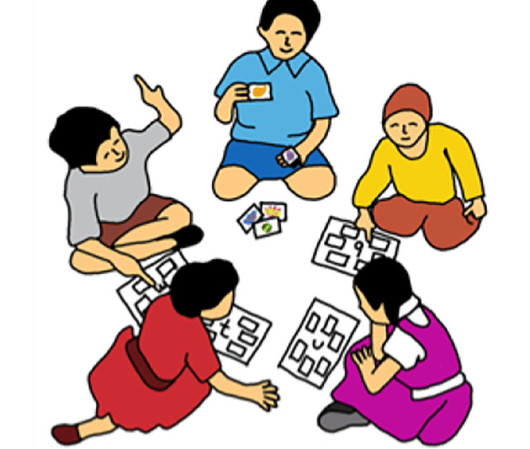 a group of people sitting around a table with puzzles