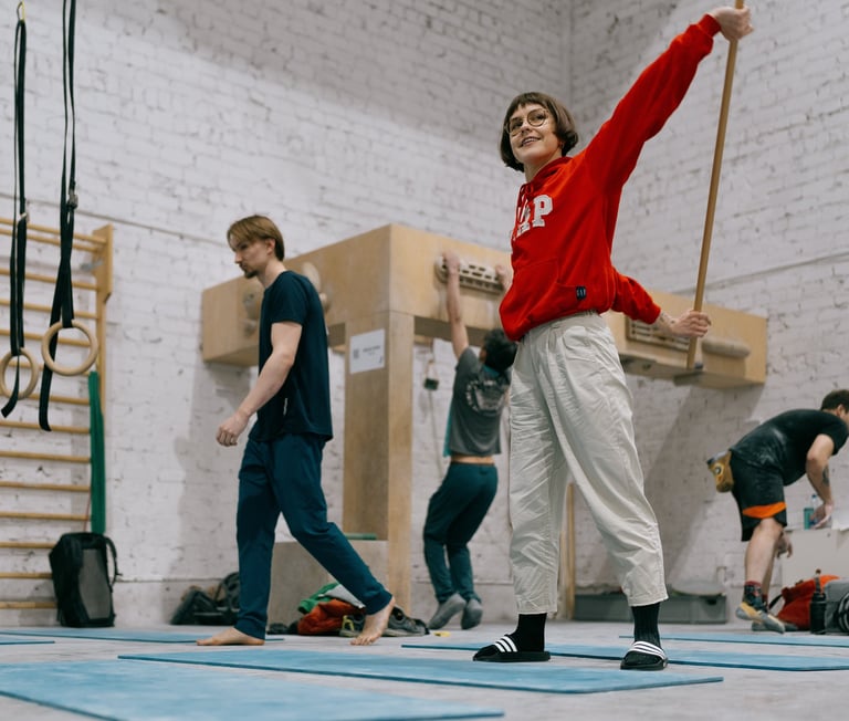 a woman in a red sweater is stretching