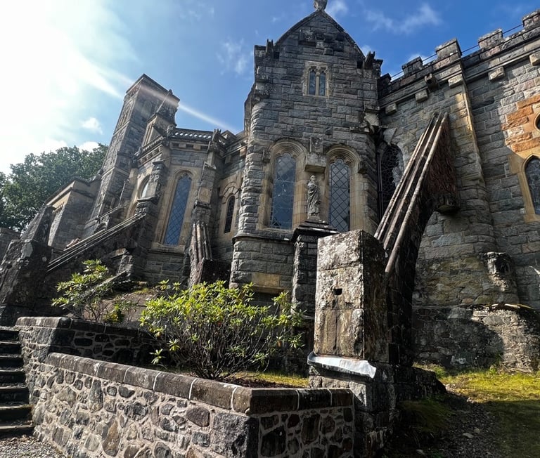a large stone building with a steeple tower