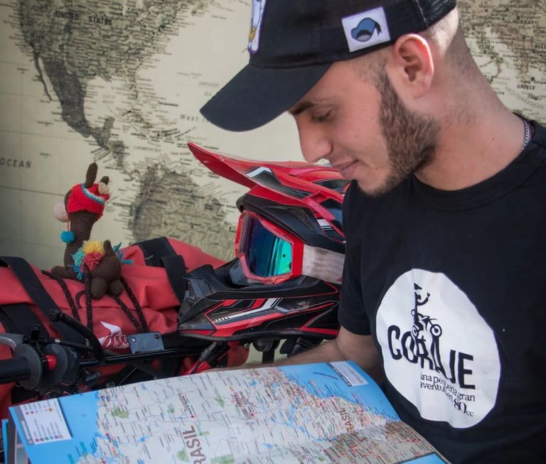 a man in a black shirt and a map of a motorcycle
