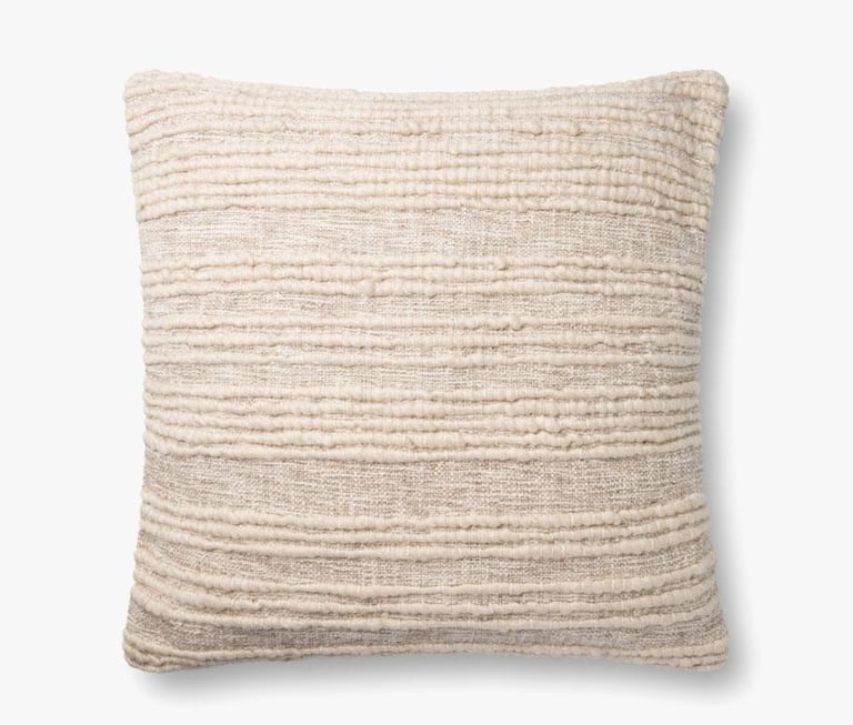 a pillow with a white and beige striped pillow
